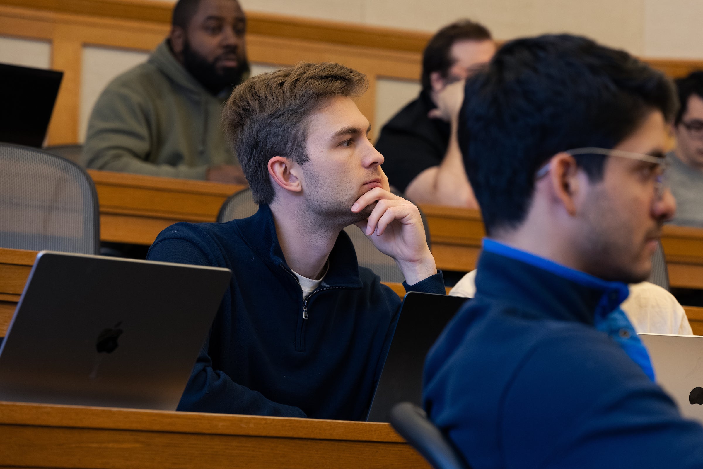 An attentive student listening to Pablo Torre.