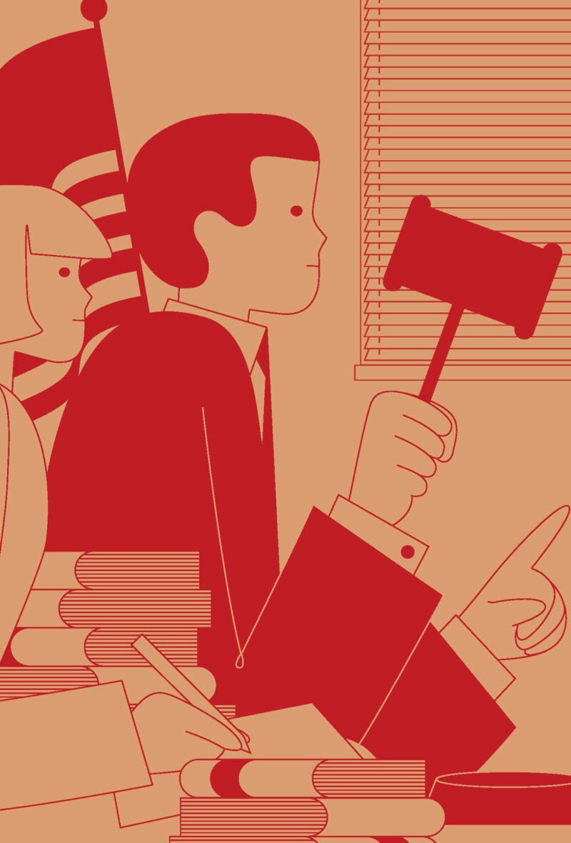 An illustration of a judge holding a in a courtroom and his clerk taking notes near a pile of law books in a courtroom.