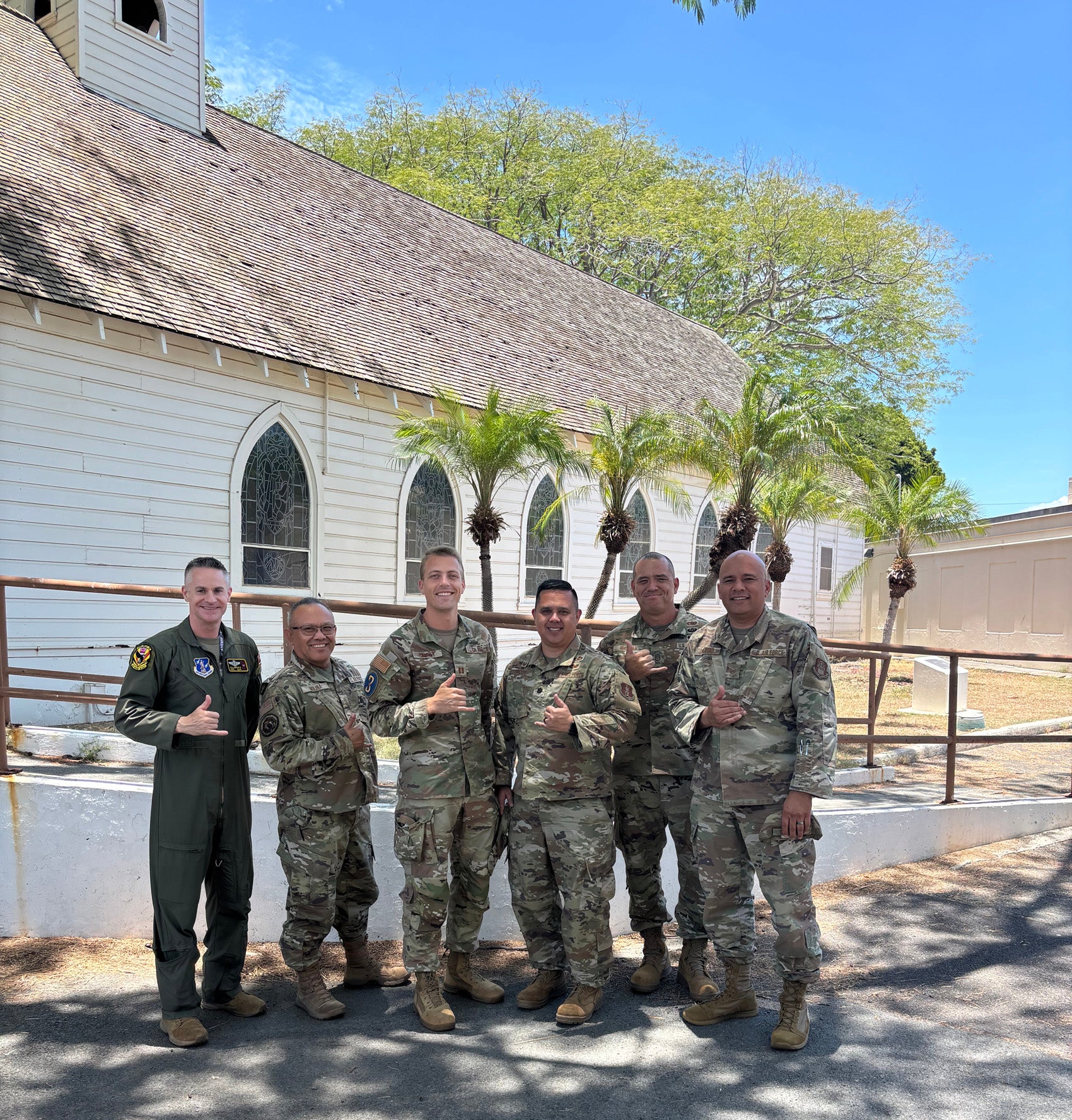 A group of men in uniform gathered for photo.