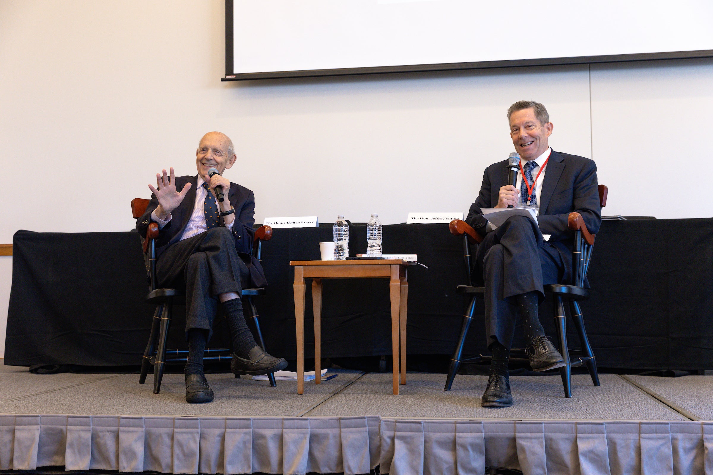 Stephen Breyer and Jeffrey Sutton speak on a panel.