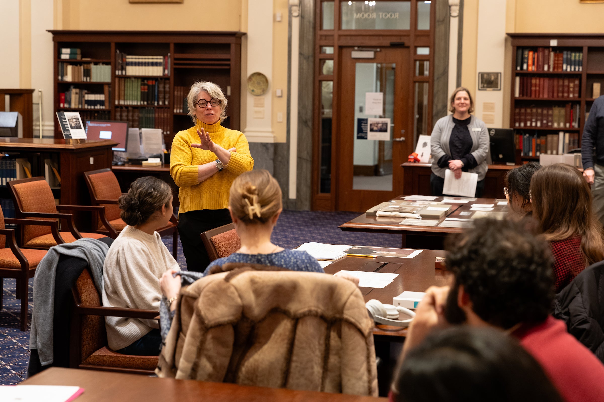 Professor Jill Lepore speaks to students in a library special collections reading room.