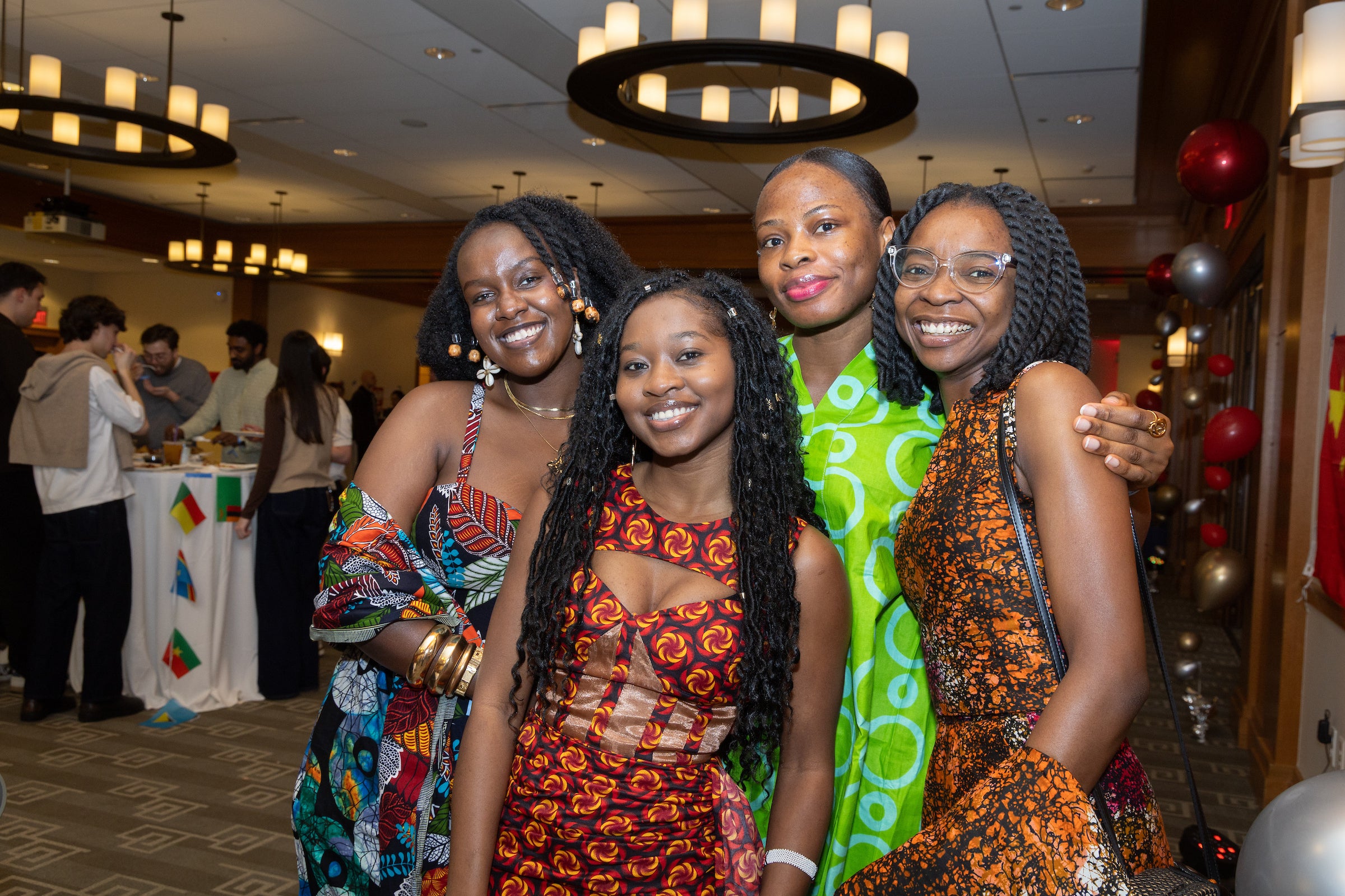 Four students pose for a photo together.