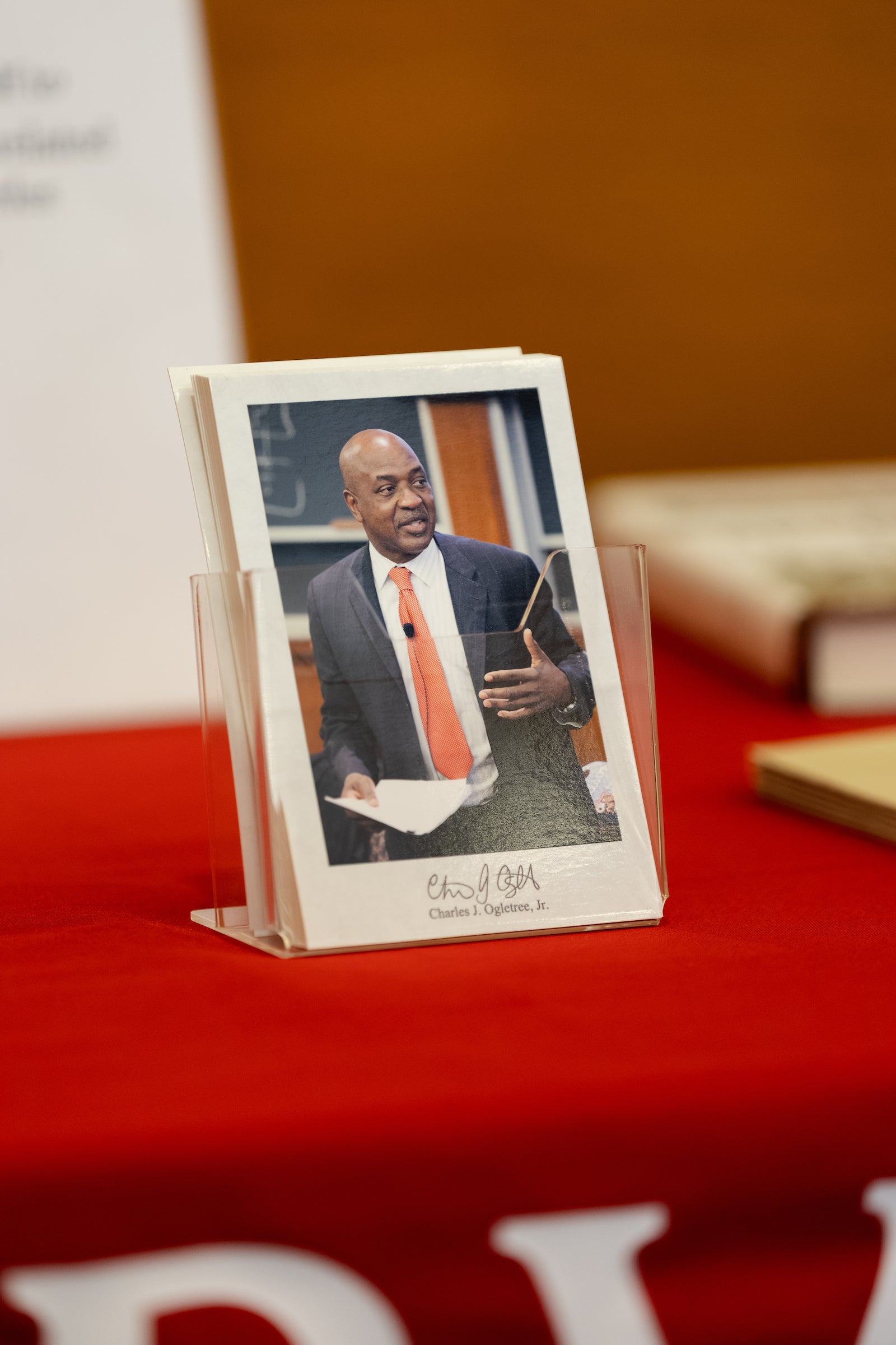 The event programs, featuring a photo of Charles J. Ogletree Jr.