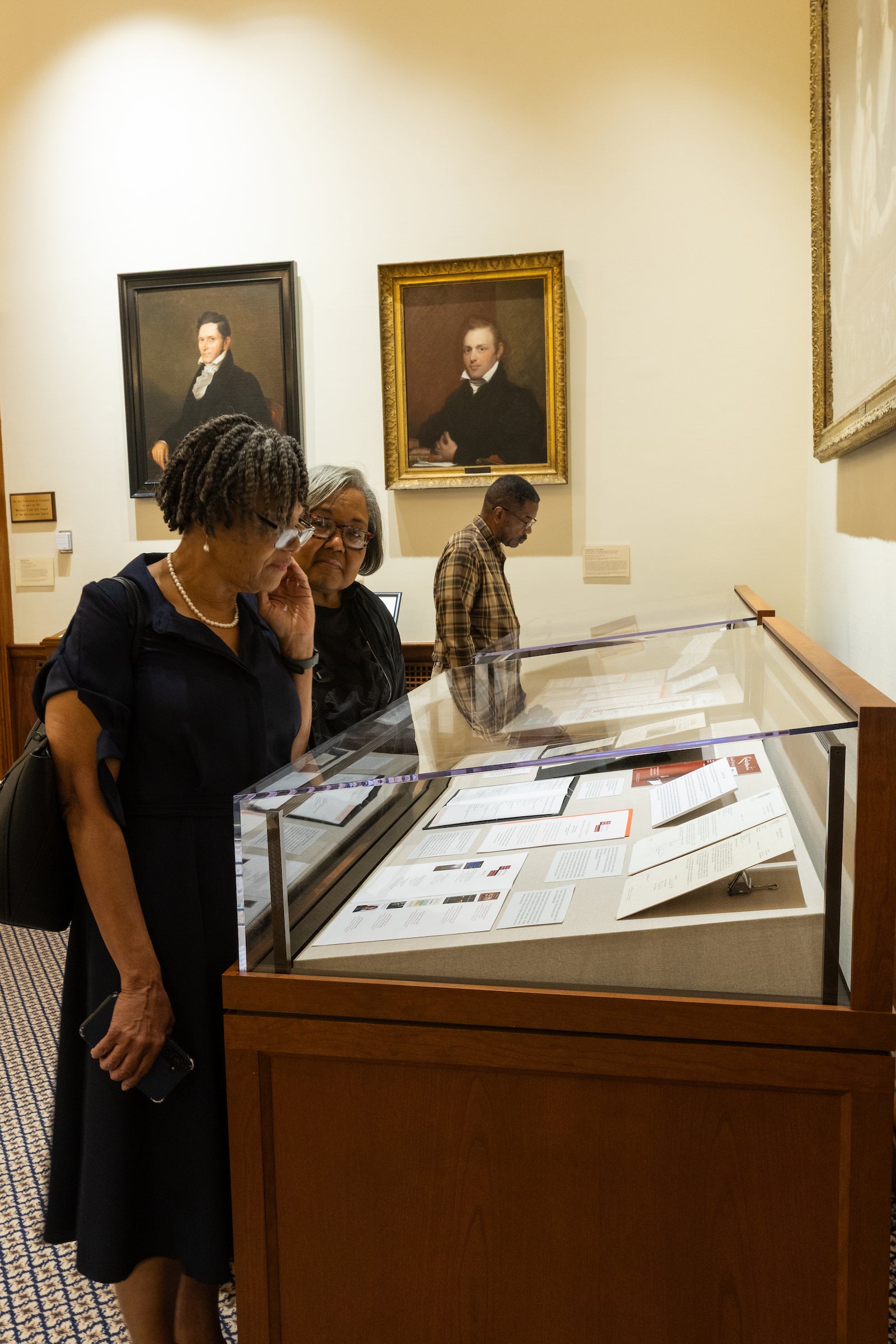 Pamela Ogletree looks at a display case.