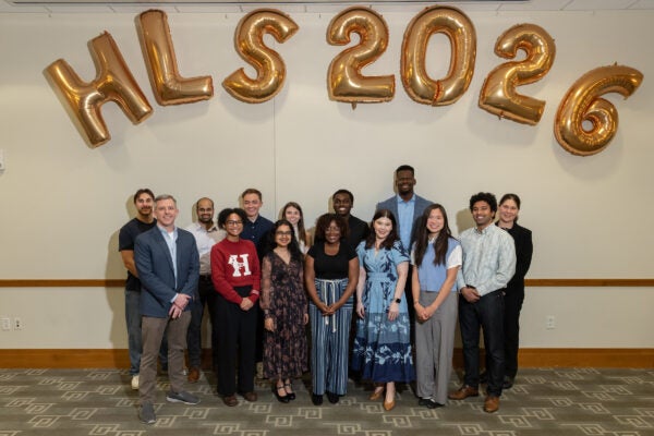 A group of students standing in front of HLS 2026 balloons