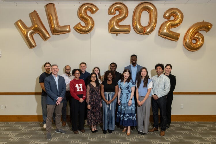 A group of students standing in front of HLS 2026 balloons