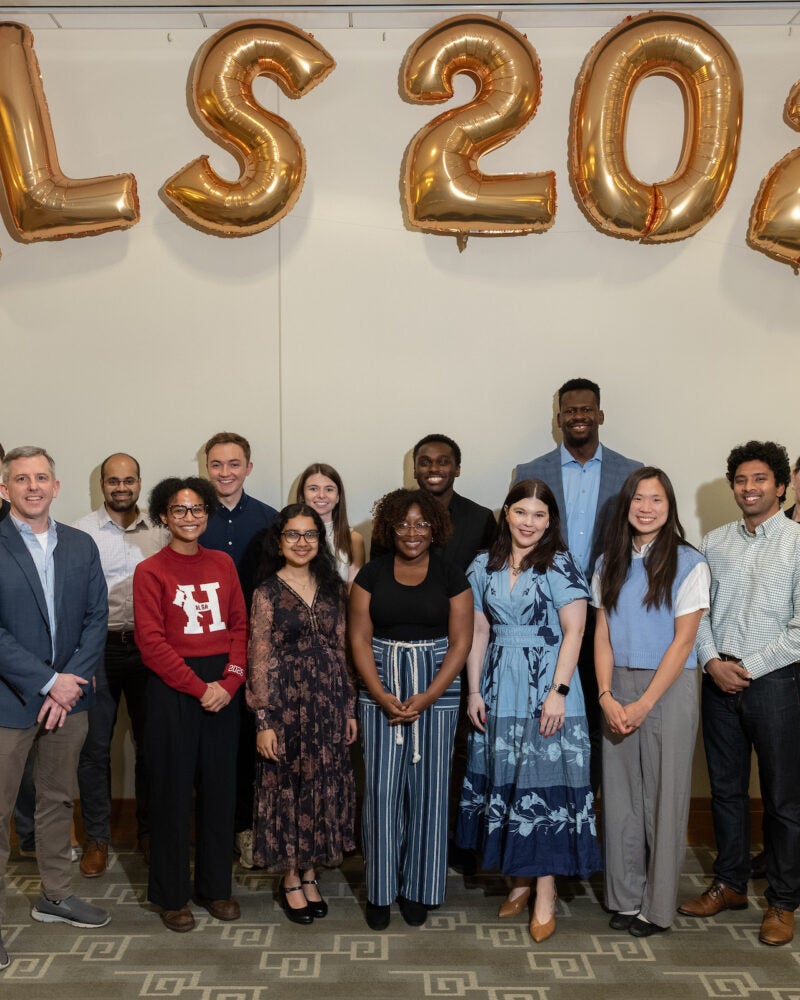 A group of students standing in front of HLS 2026 balloons
