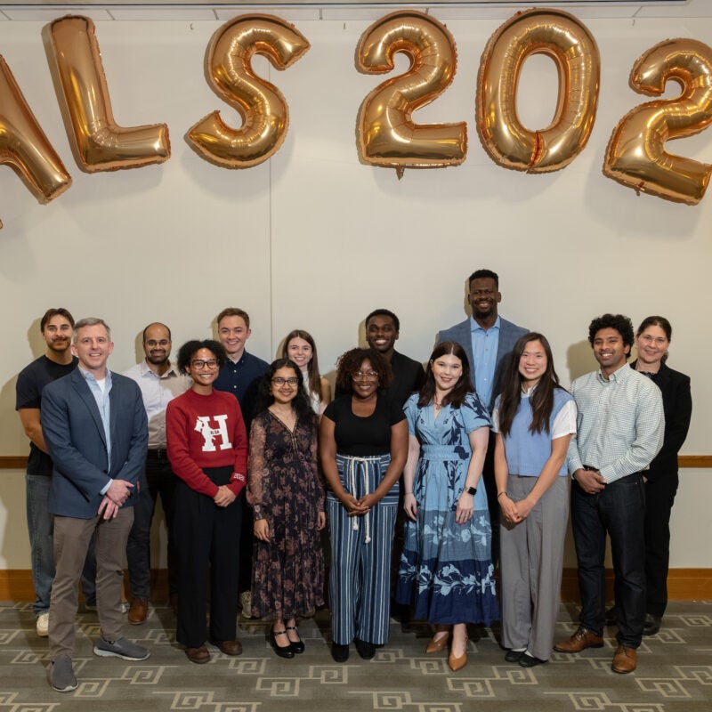 A group of students standing in front of HLS 2026 balloons