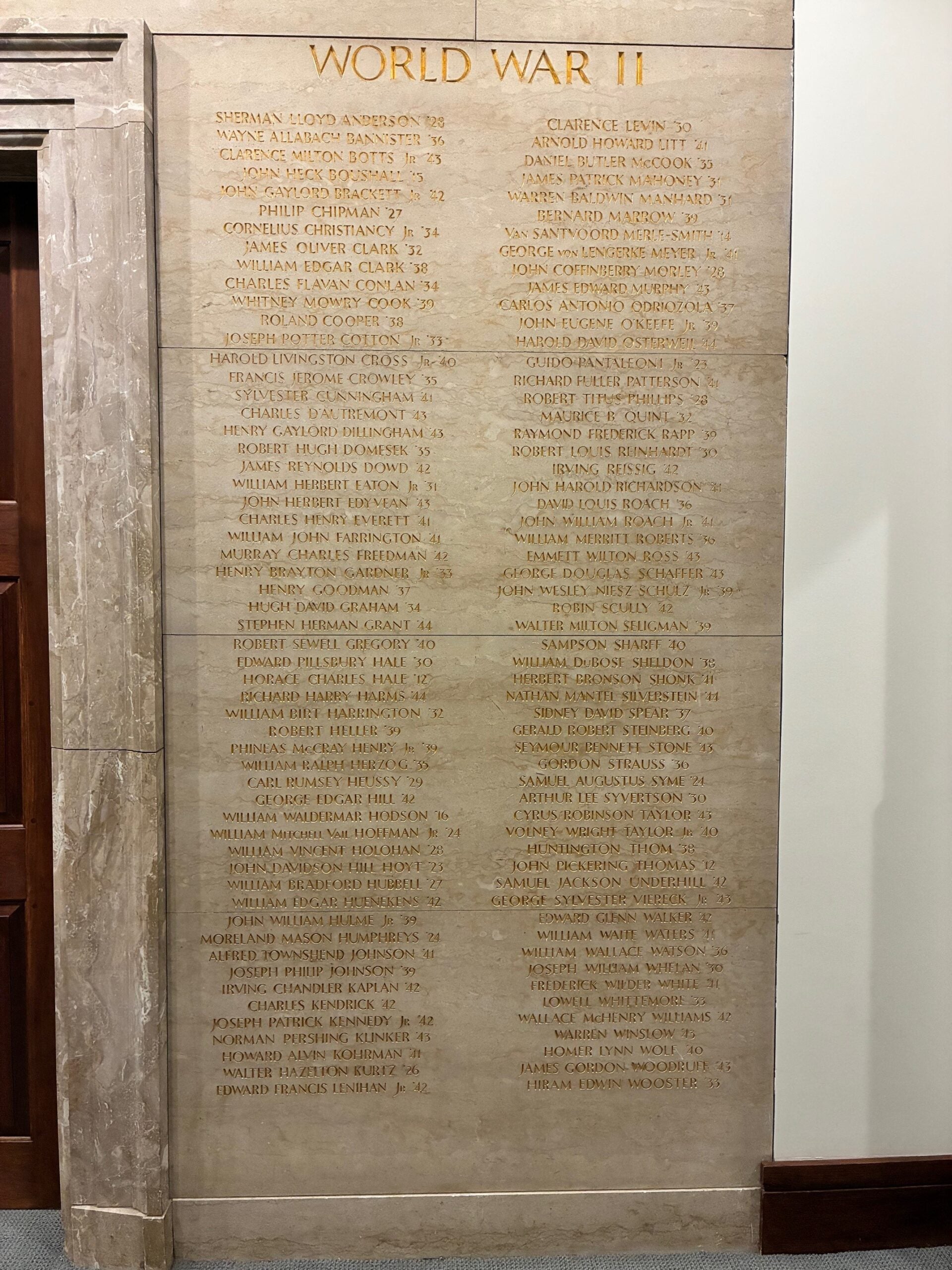 HLS memorial wall with list of alumni lost in World War 2.