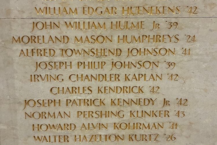 Close up of names on memorial wall.
