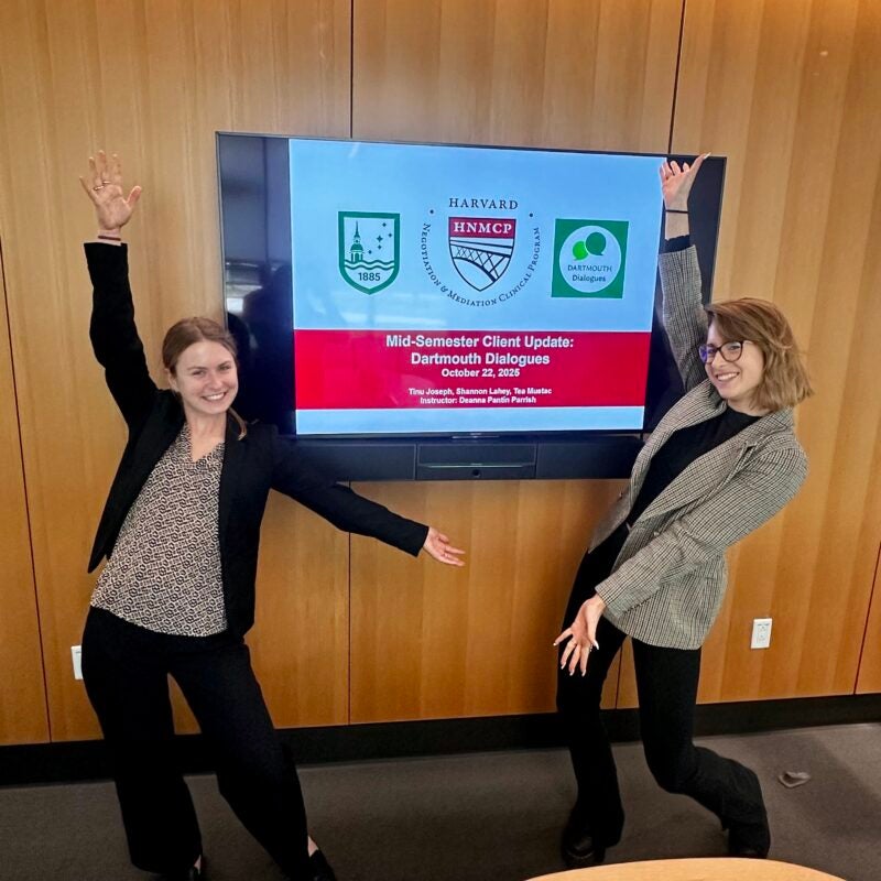 Two women presenting Clinics update.