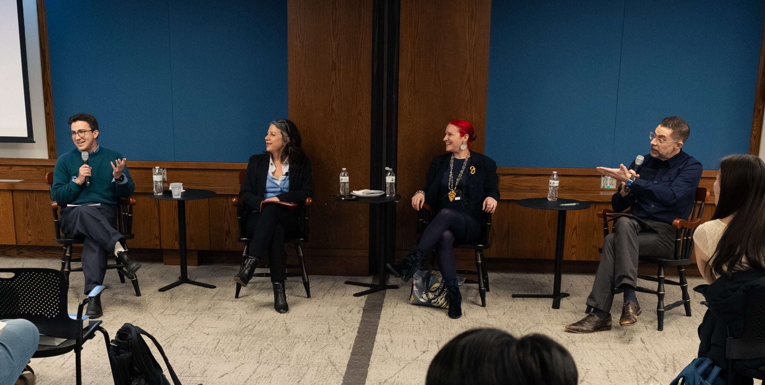 Four panelists speaking to class.