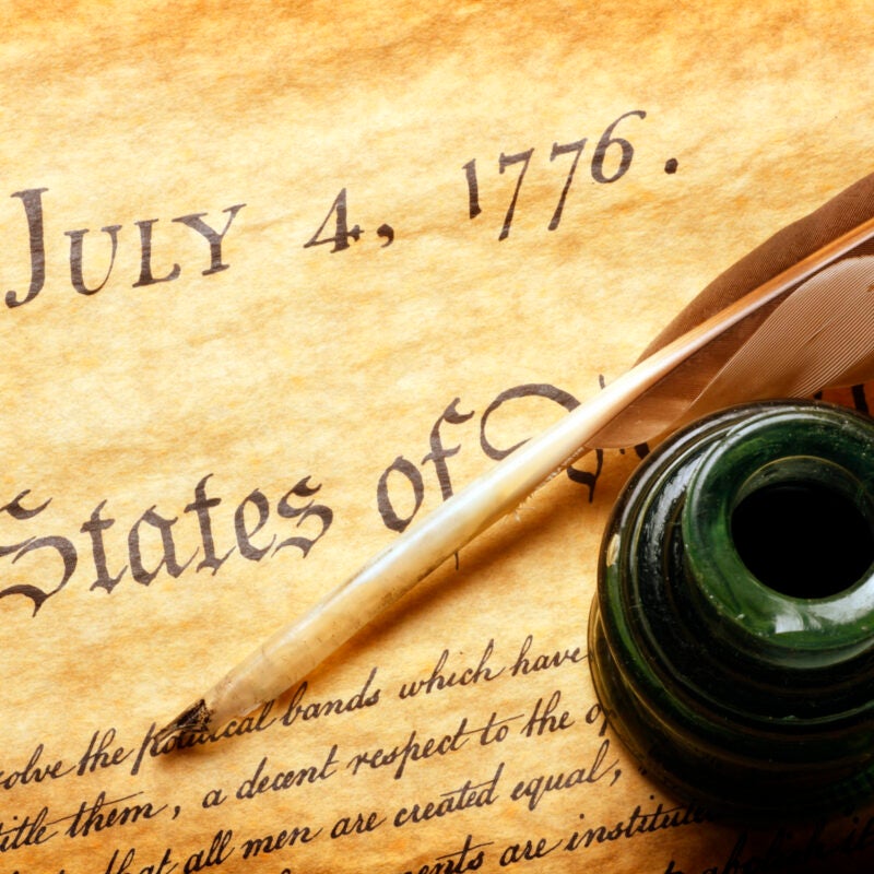 Quill and inkwell on top of Declaration of Independence.