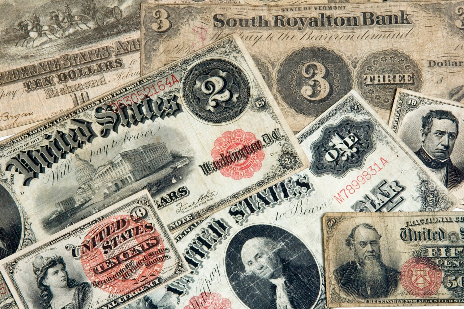 A variety of early American currencies.