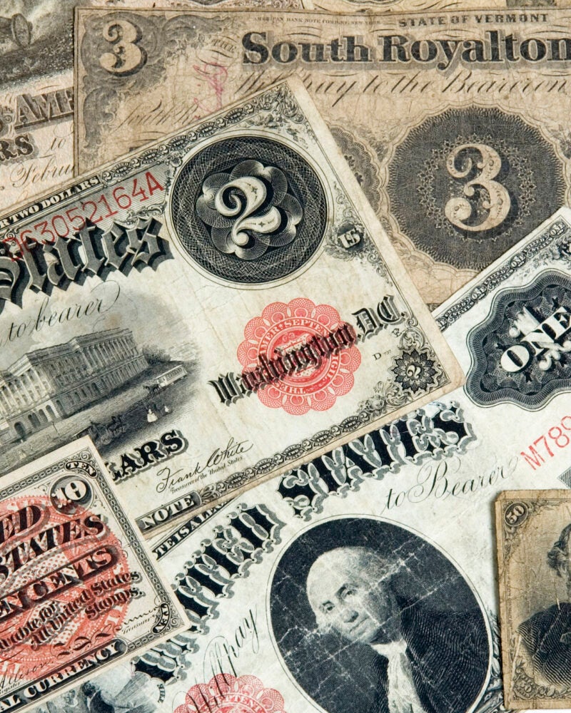 A variety of early American currencies.
