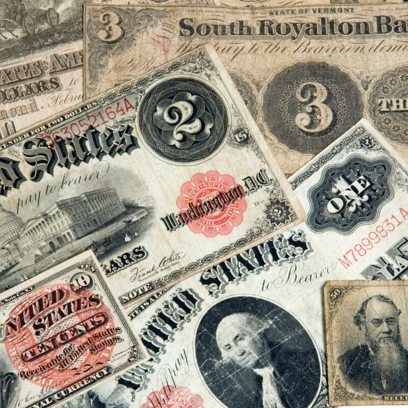 A variety of early American currencies.
