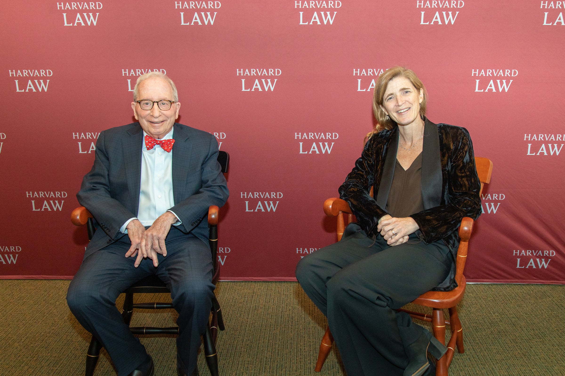 William Zabel and Samantha Power posing for a photo on a stage.