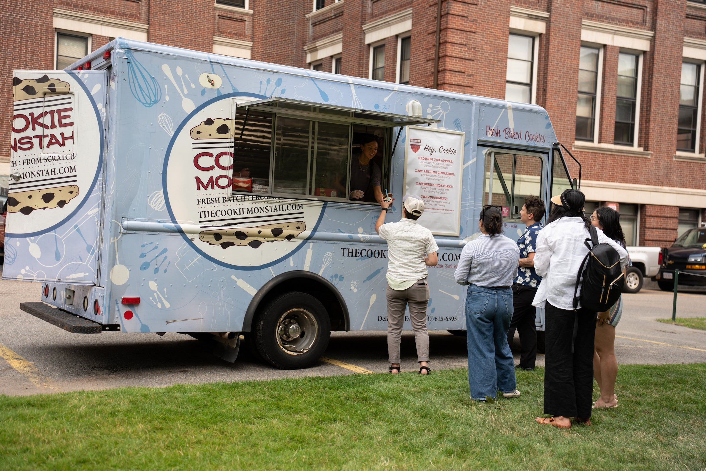 A light blue food truck labeled 