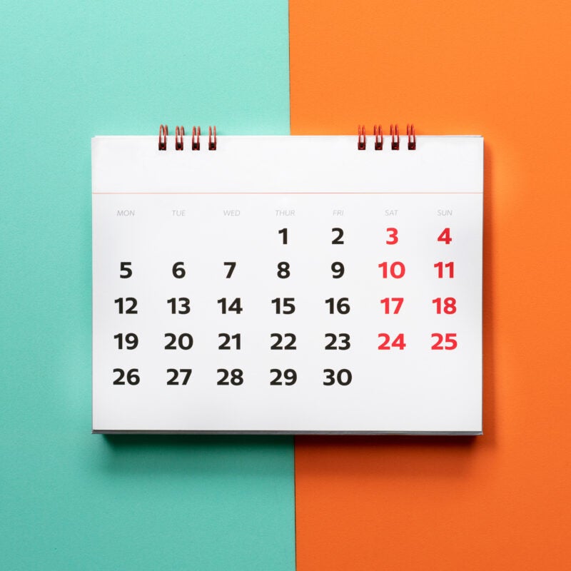 close up of calendar on green and orange background