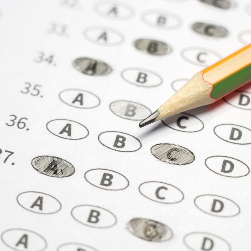 optical form of standardized test with answers bubbled and a pencil