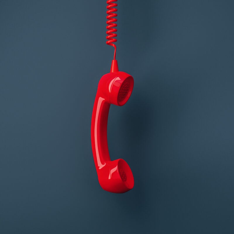 Image of red landline telephone receiver