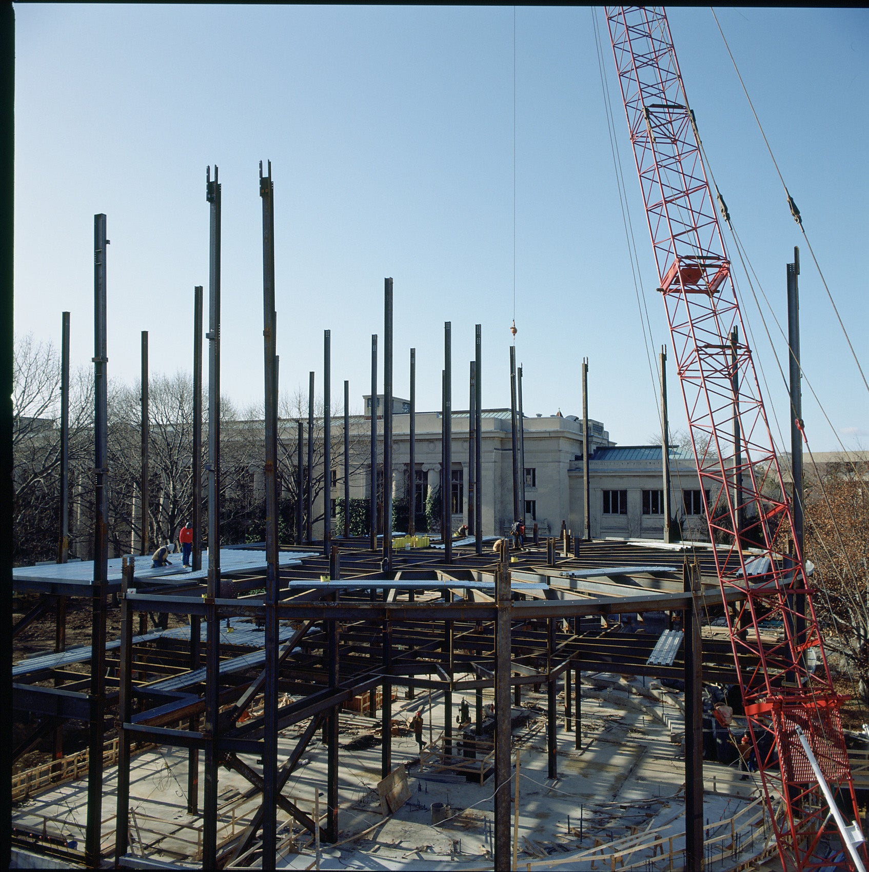 An aerial shot of the steel beams of a building under construction.