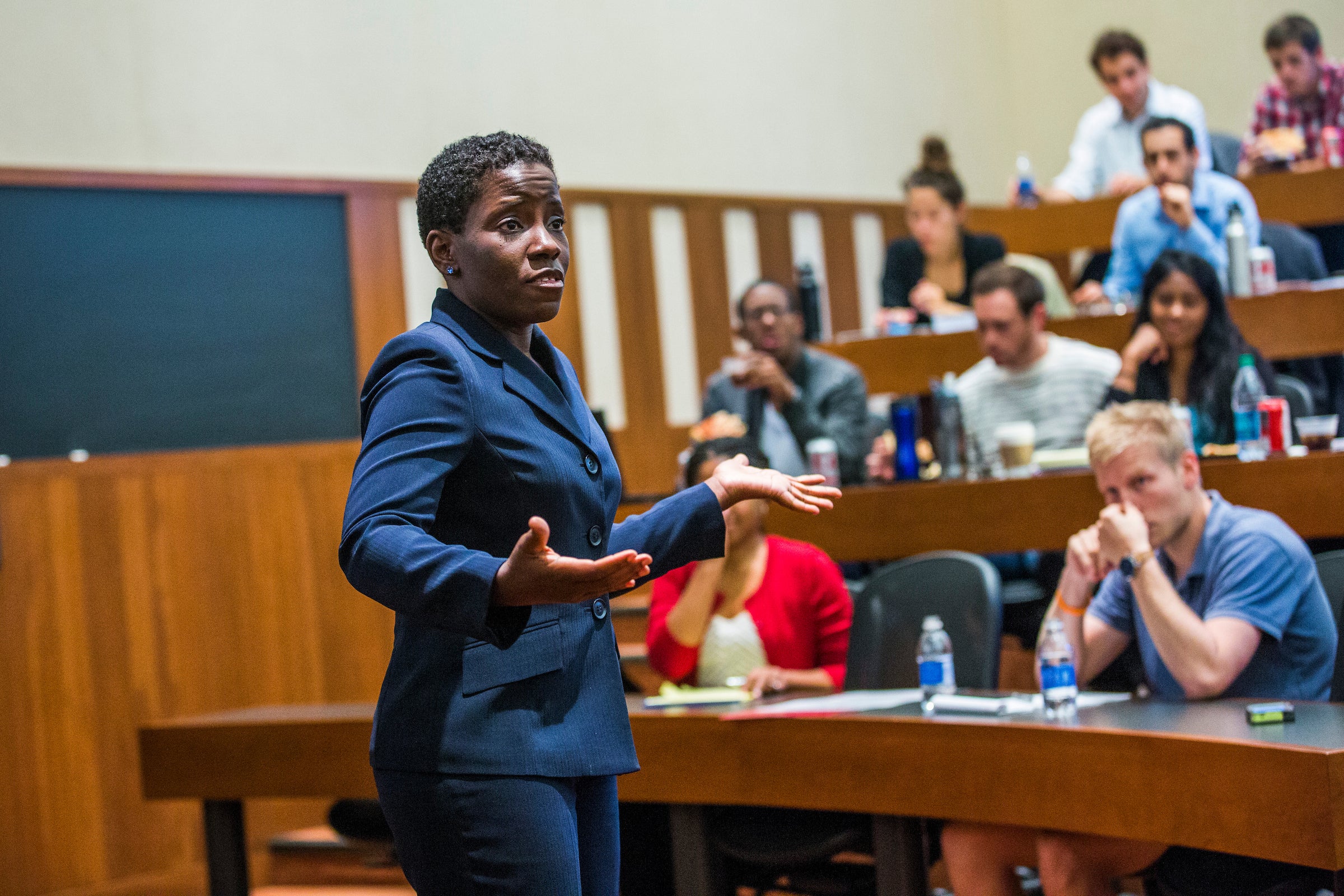 A professor teaching in a classroom.