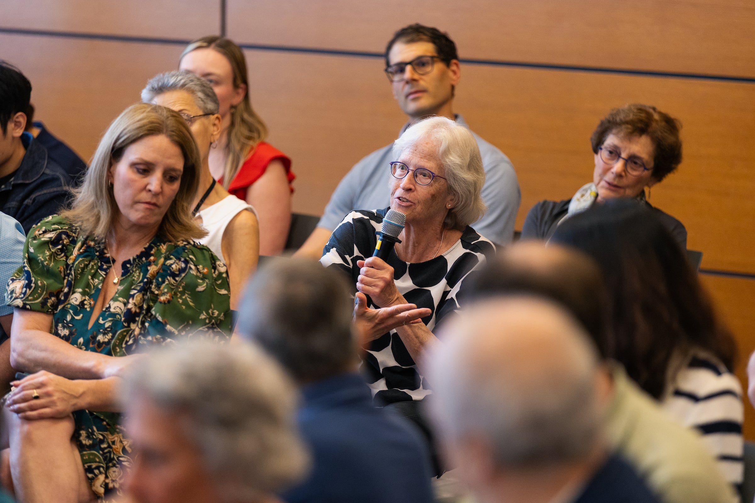 An audience member asks a question.