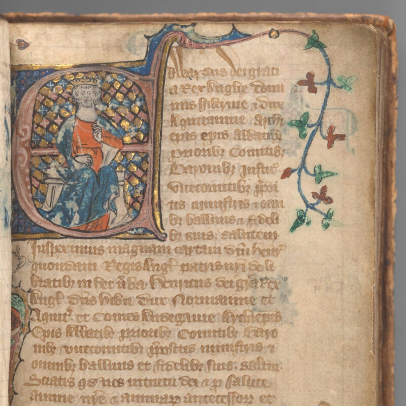 Manuscript page showing illuminated initial of King Edward II before a gold and blue checkered background.