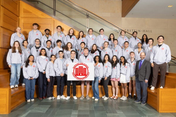 the TAP 25-26 student body poses in the WCC lobby with their sign in matching sweatshirts