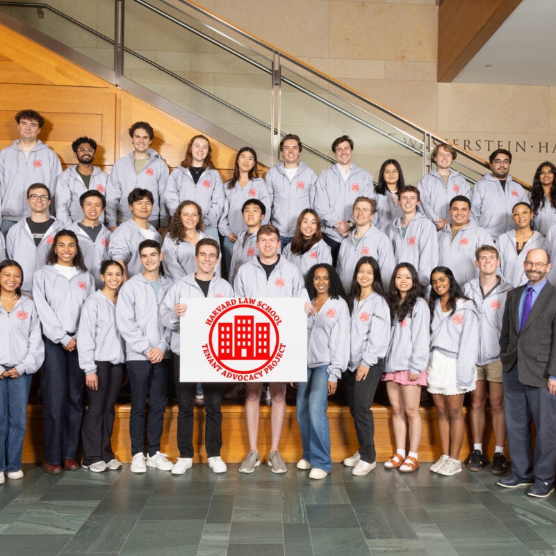 the TAP 25-26 student body poses in the WCC lobby with their sign in matching sweatshirts