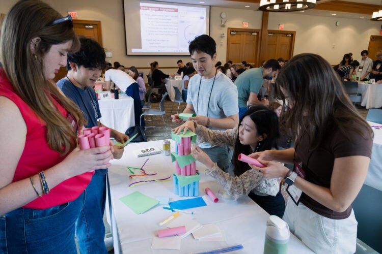 Students building a tours with paper.