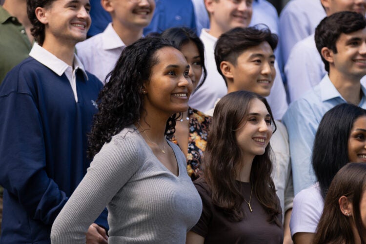 Students smile for a group photo.