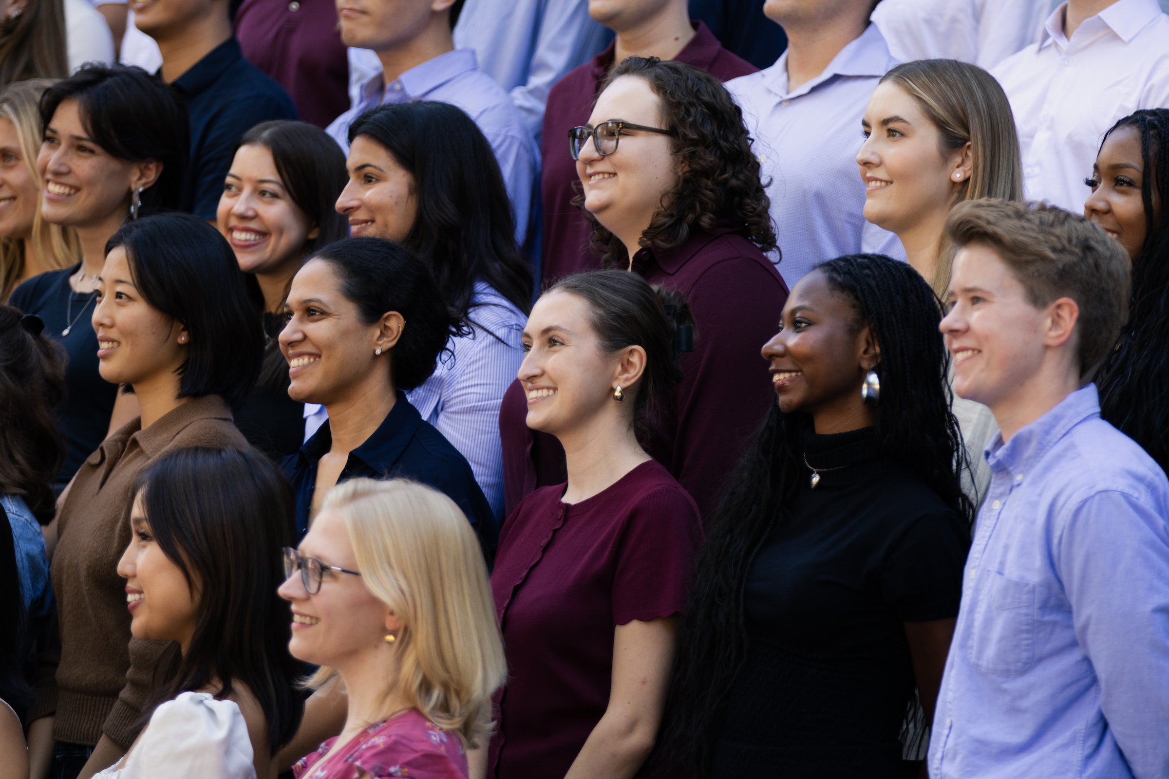 Students smile for a group photo.