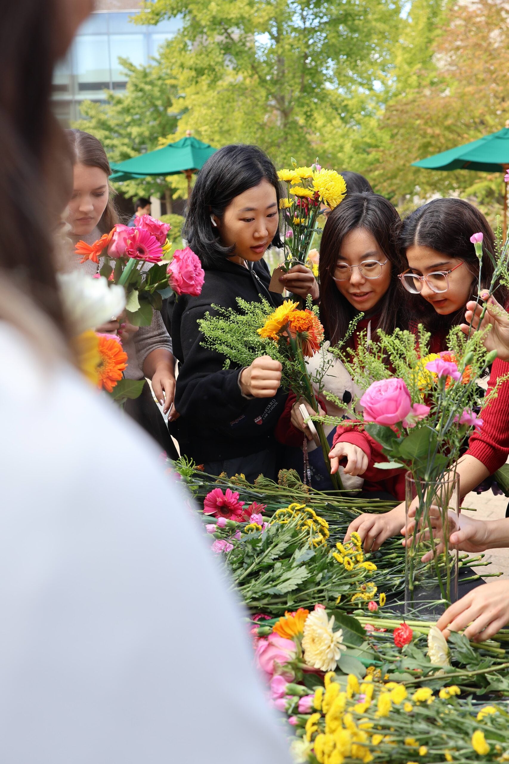 A group of students creating bouquets