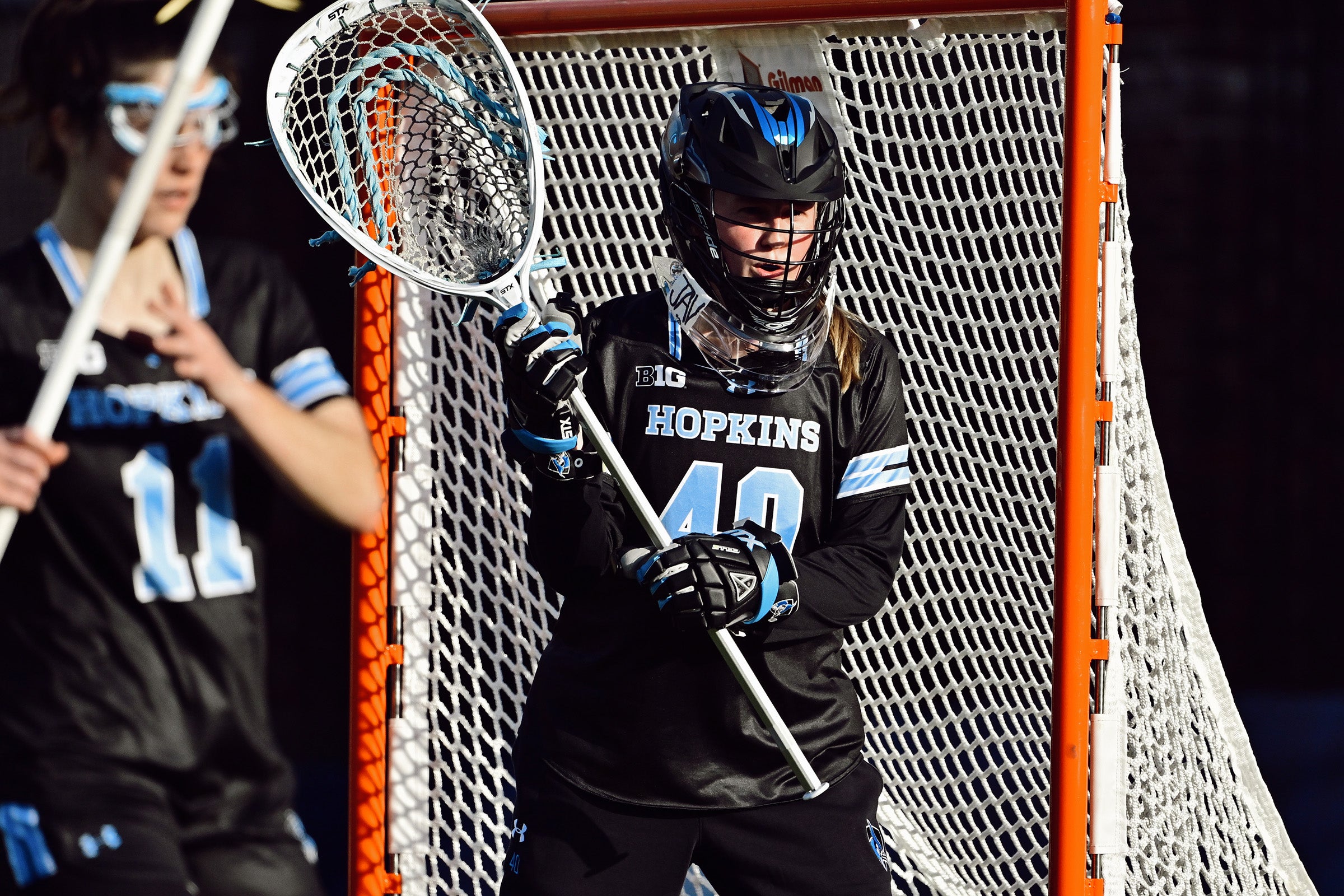 Margaret Tydings playing lacrosse.