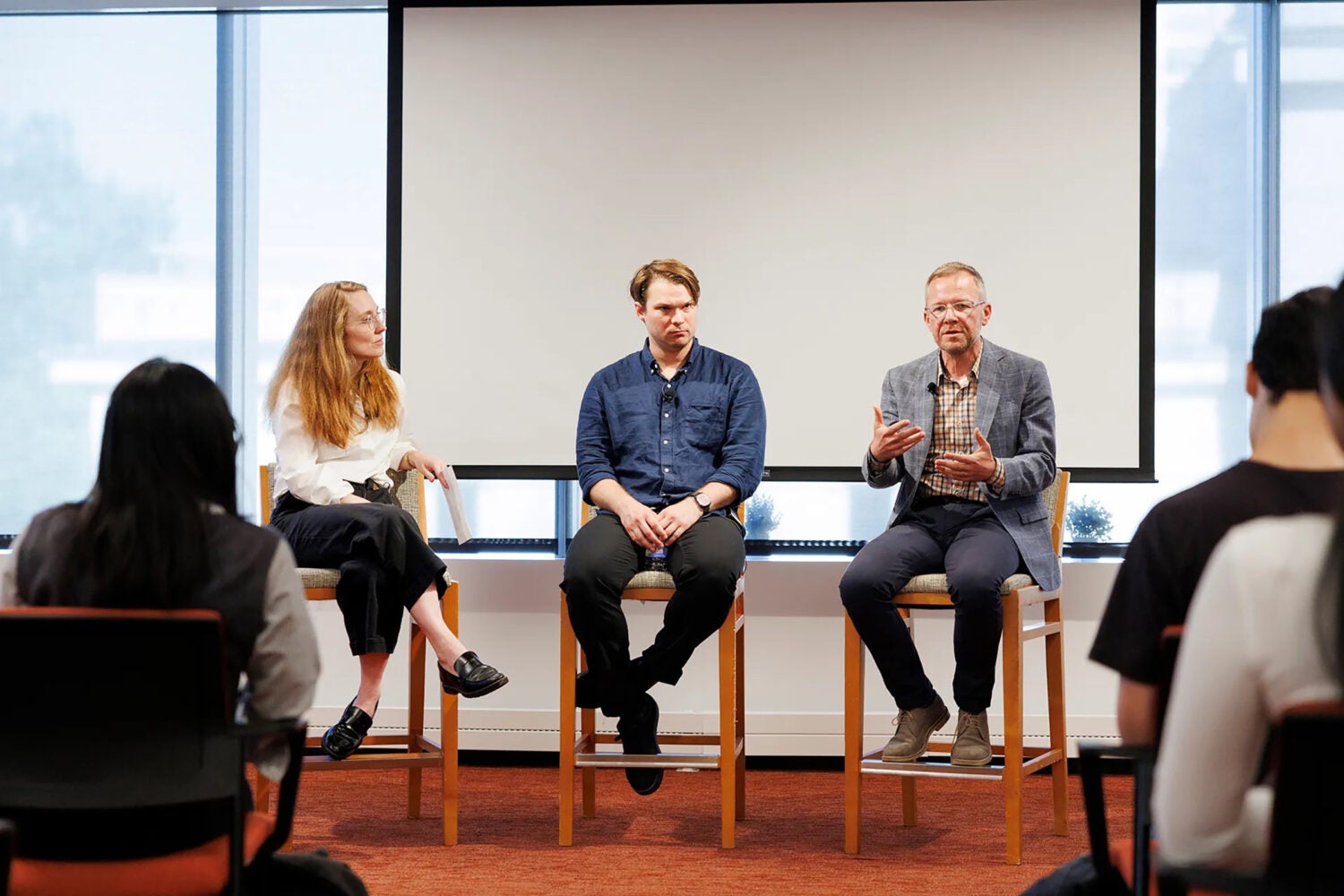 Host Moira Weigel (from left) with panelists Jackson Kernion of Anthropic and Ken Archer of Microsoft.