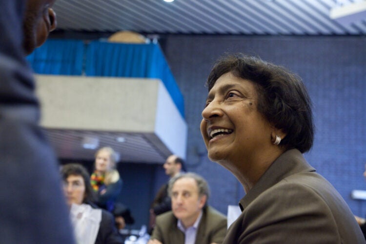 Navi Pillay smiles while engaging in conversation.