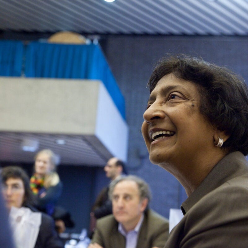 Navi Pillay smiles while engaging in conversation.