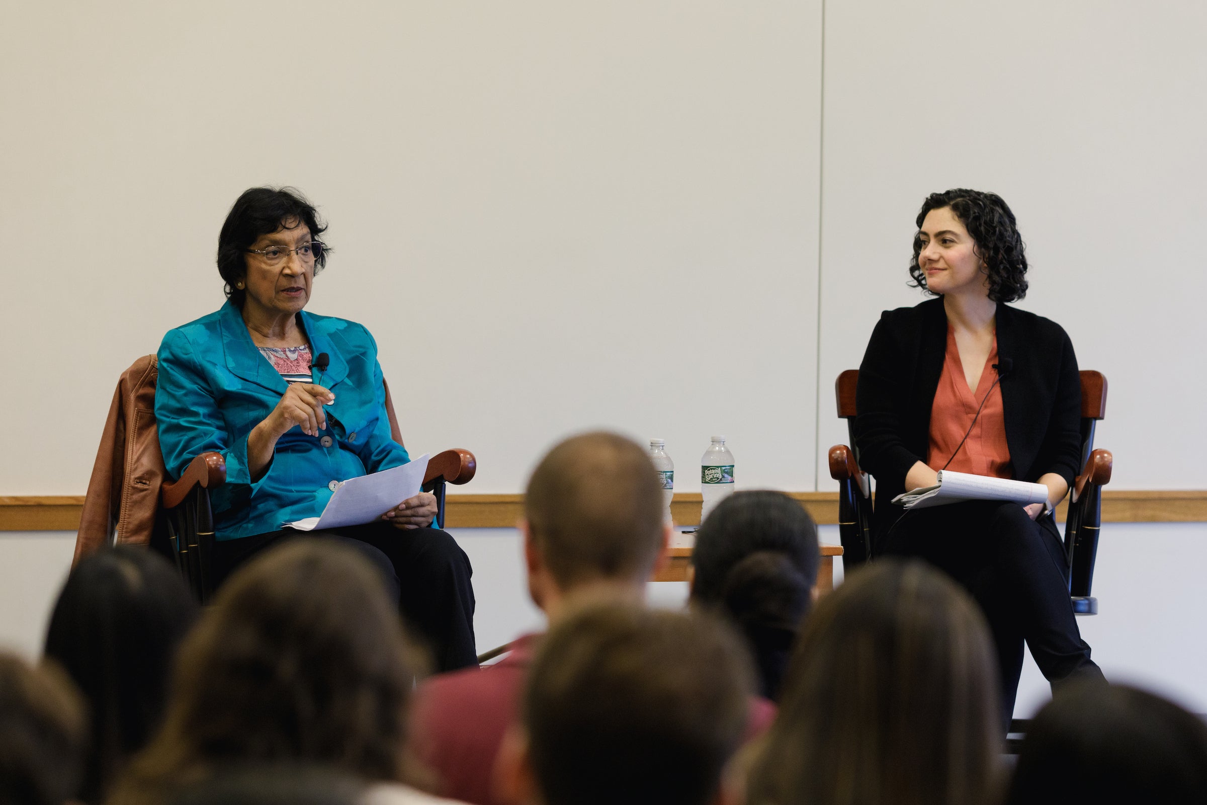 Navi Pillay addresses the audience while seated on a stage with Susan Farbstein.