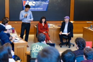 Elizabeth Prelogar and Richard Lazarus are introduced by a student.