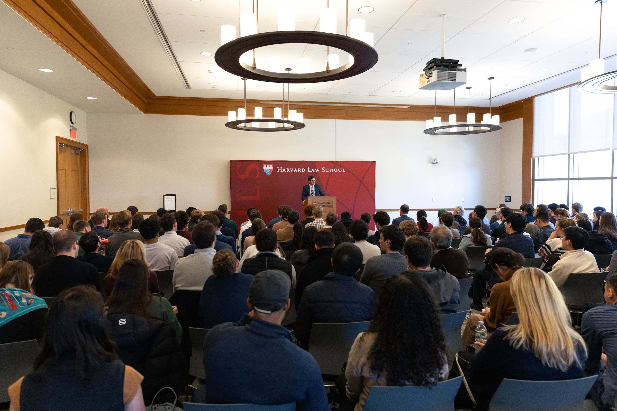 Jud Campbell speaking before a large audience.