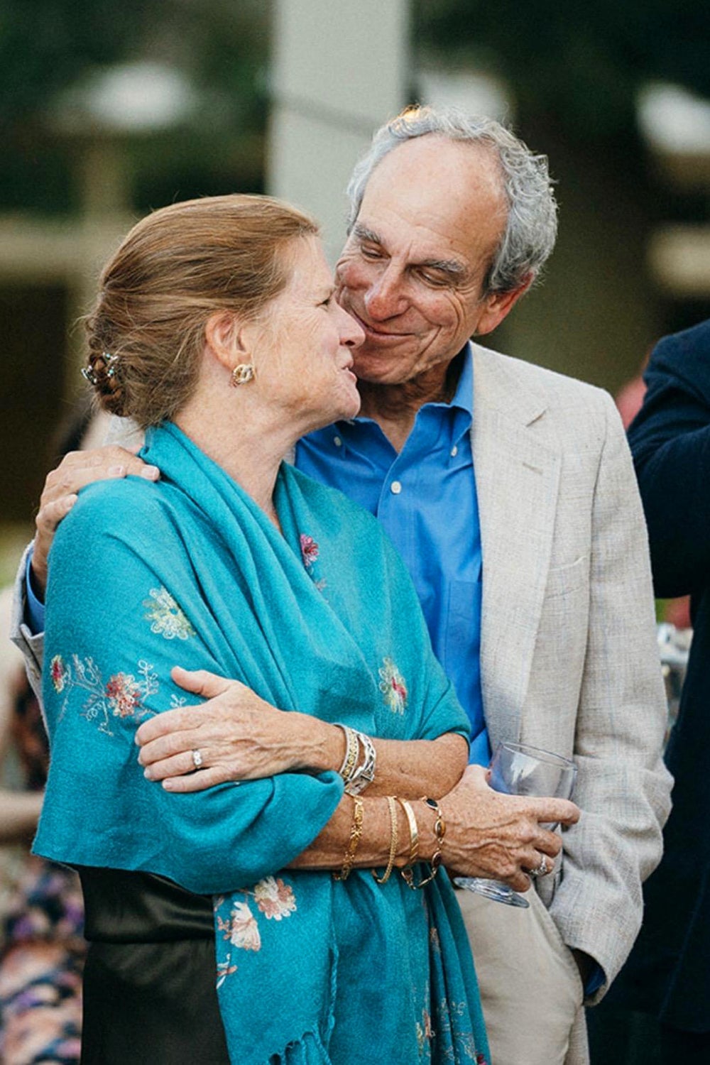 Robert Gage and wife holding each other