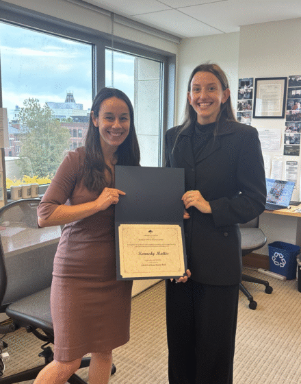 Merry Boak and Kennedy Mattes stand in PLAP holding the AALS certificate