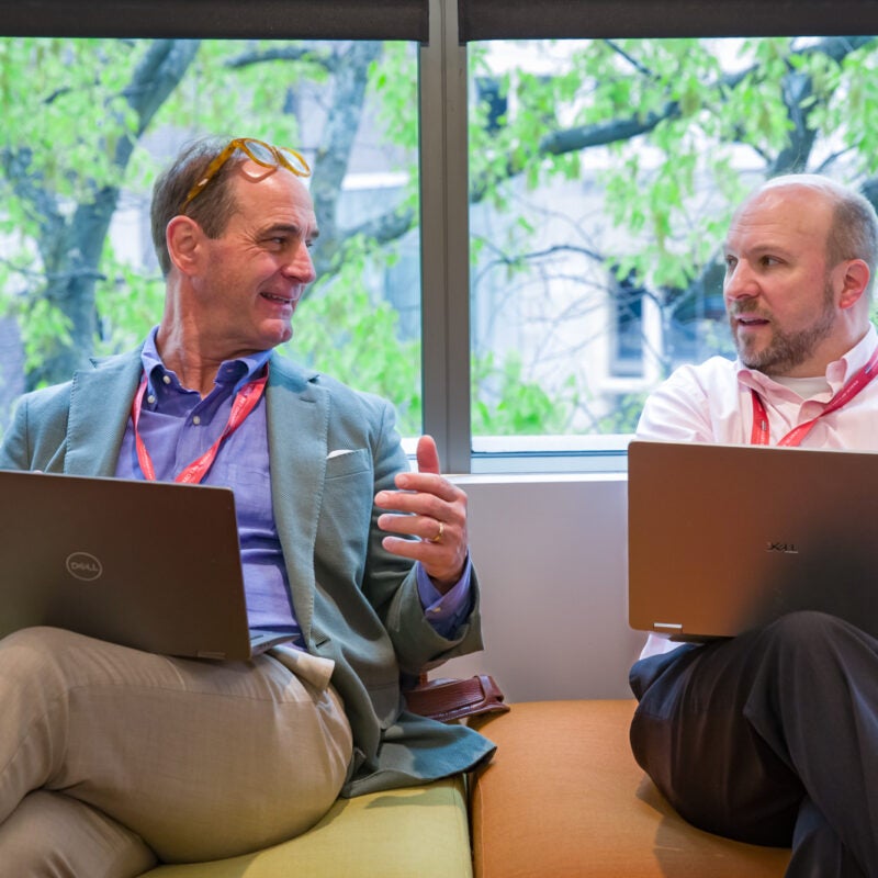 Two Harvard Law School Executive Education participants talking.