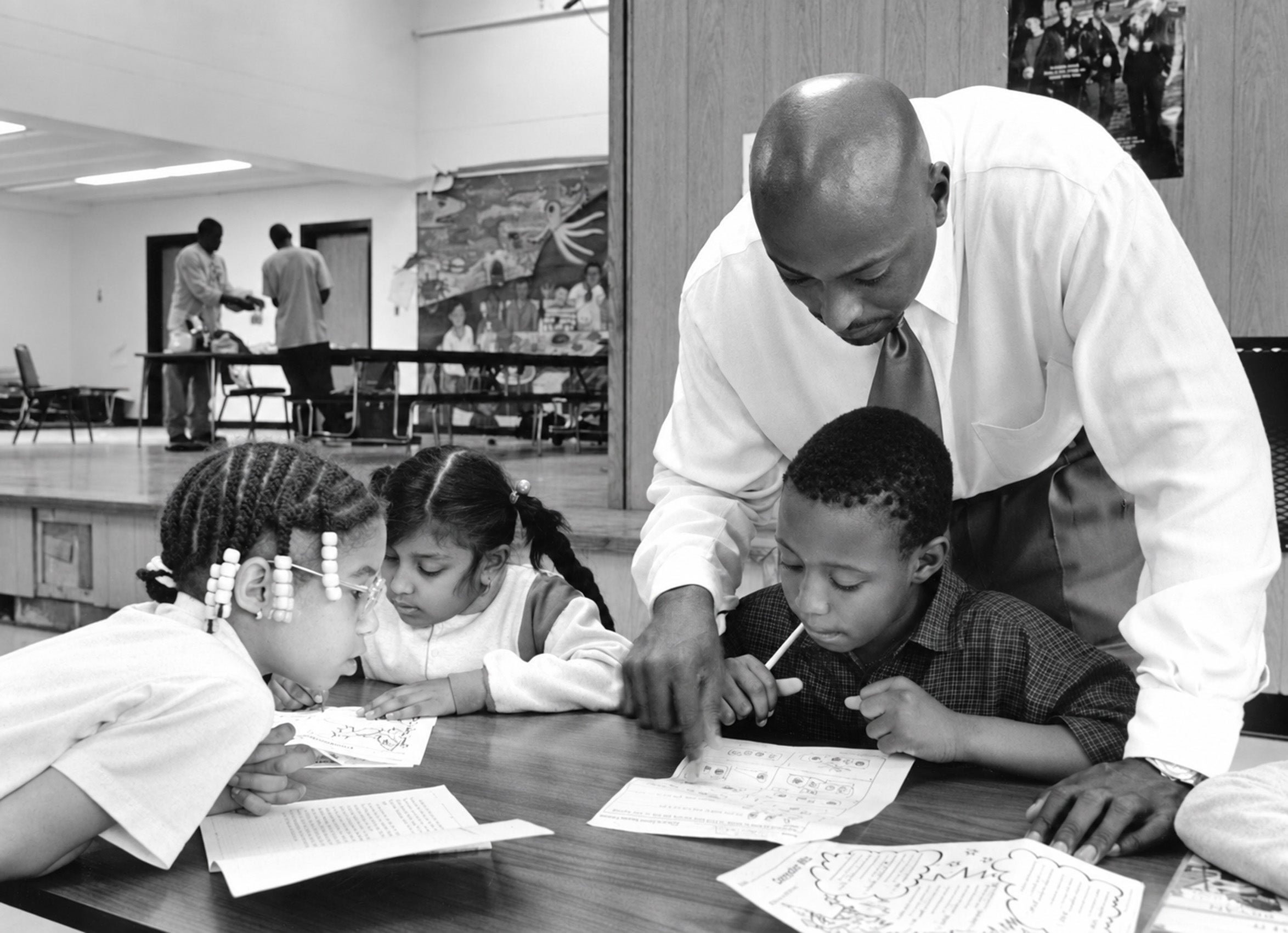 Earl Phalen helping students with some homework.