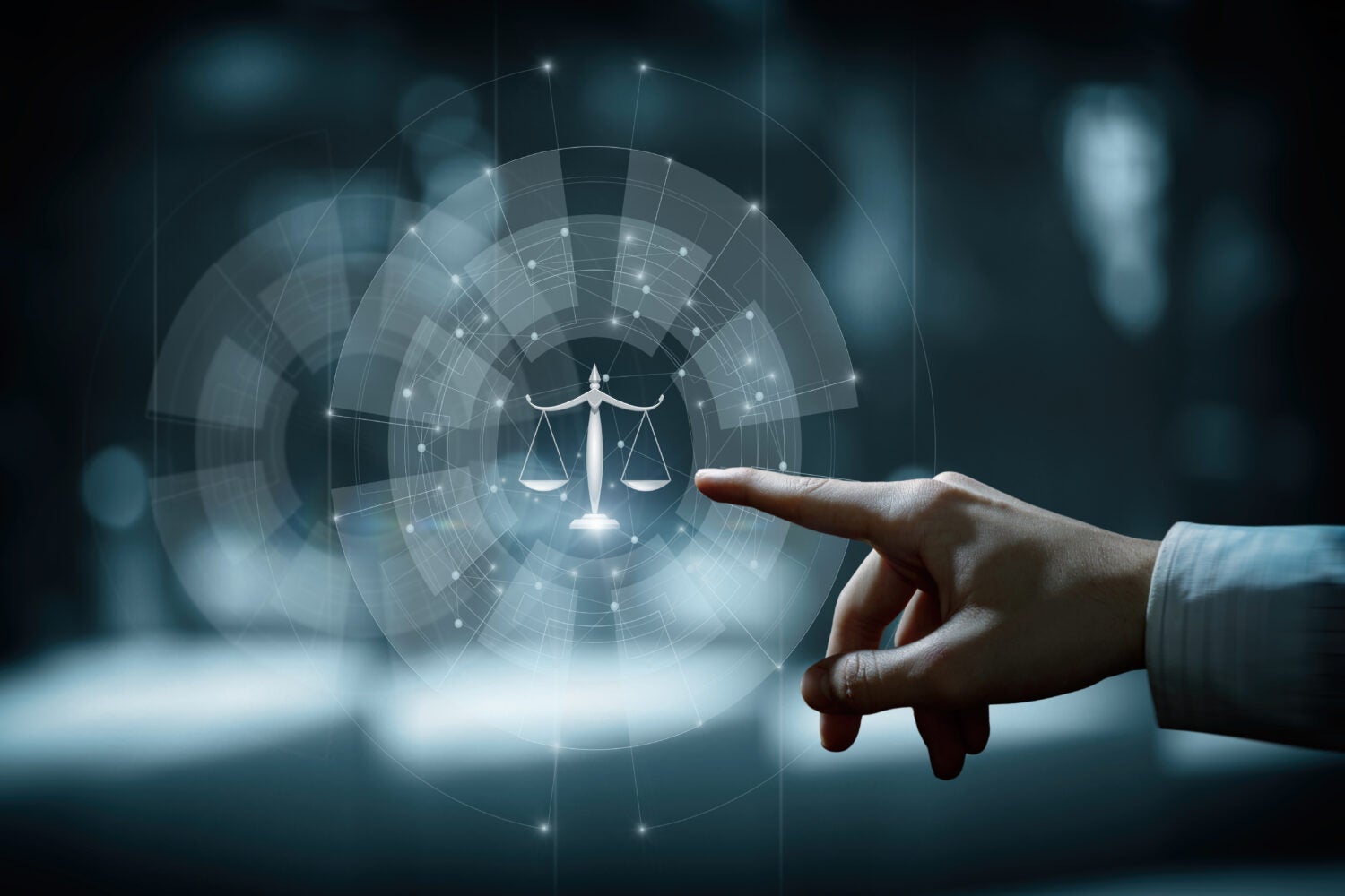 Hand clicks on scales of justice. Concepts of legal services and justice.